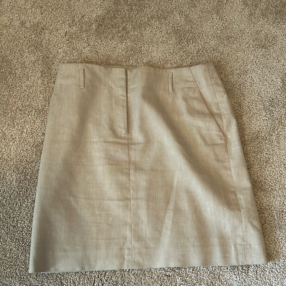 Ann Taylor brand, tan skirt with zipper and belt holder, (fake pockets).